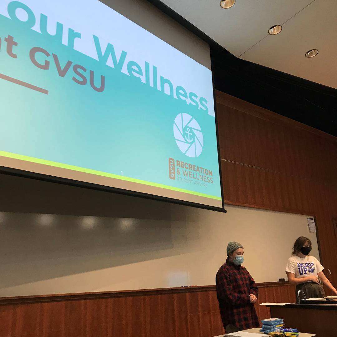 Image of two WIT peer educators presenting Your Wellness at GVSU